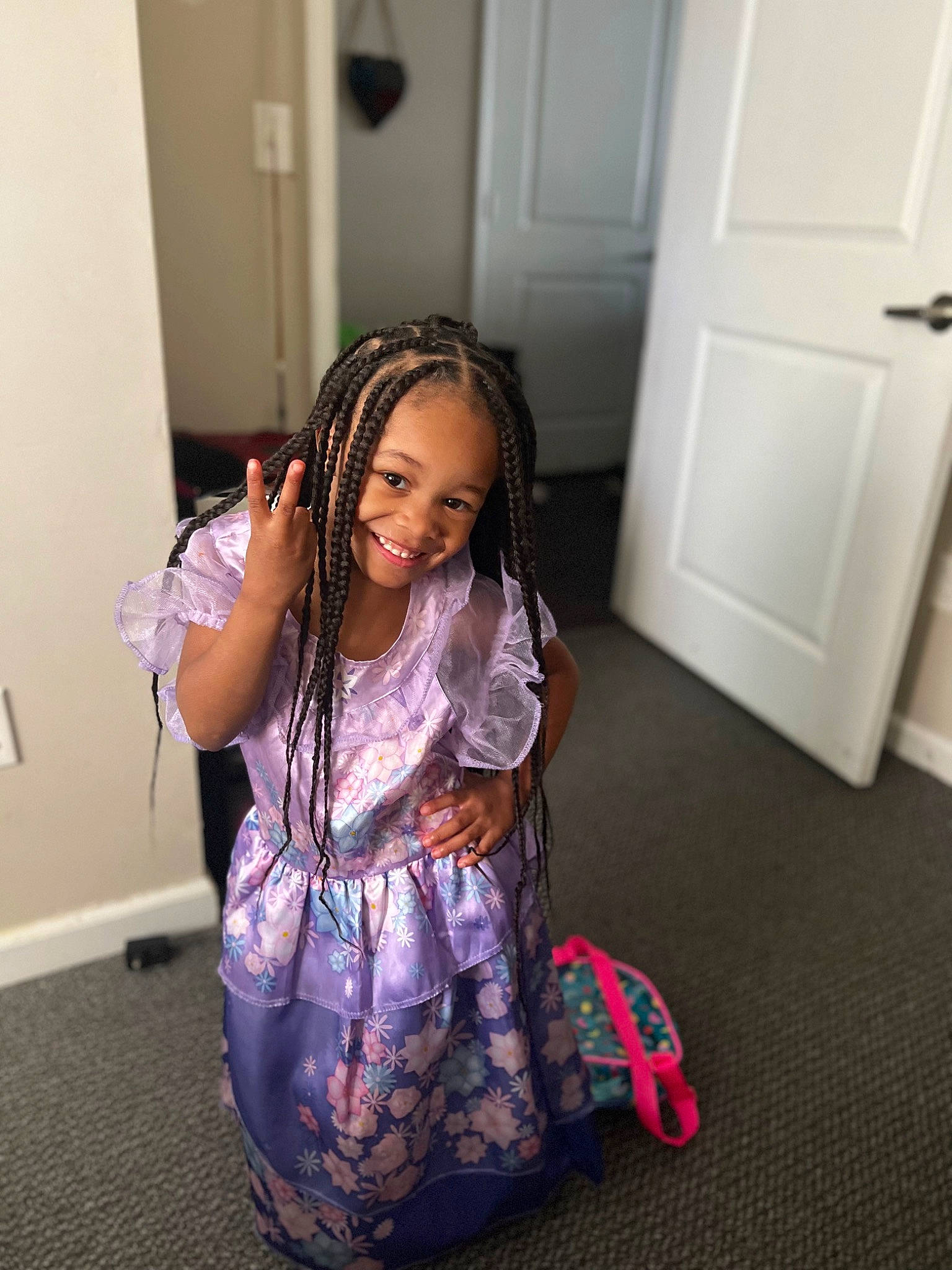 Tommie Jones is registered to the contest to win money with this photo: black_hair, door, event, eyewear, fashion_accessory, fashion_design, floor, flooring, fun, happy, joy, long_hair, magenta, pattern, person, purple, room, shoulder, sleeve, smile