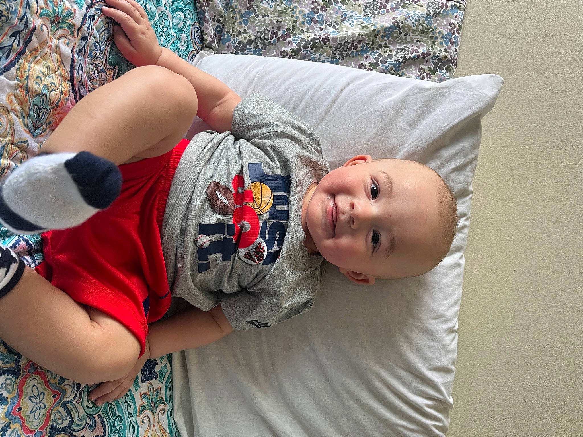 Kason is registered to the contest to win money with this photo: arm, baby, baby_toddler_clothing, comfort, elbow, fun, glasses, grass, happy, joint, joy, leisure, person, plant, sitting, sleeve, smile, t_shirt, thigh, toddler