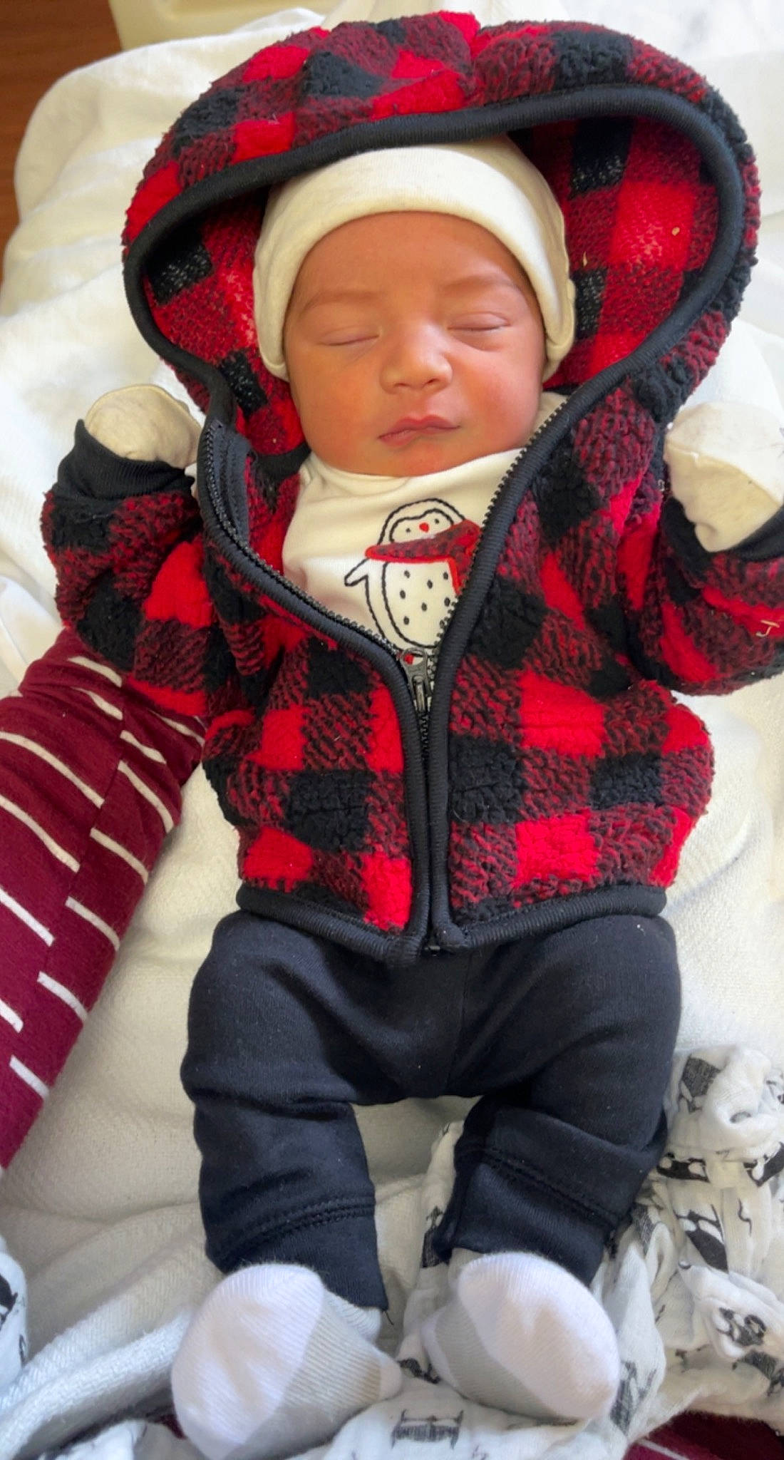 Damari joined the competition — help win amazing prizes! baby, baby_toddler_clothing, cap, comfort, cool, glove, head, headgear, headwear, knit_cap, organ, outerwear, pattern, person, personal_protective_equipment, plaid, red, skin, sleeve, toddler