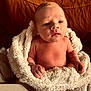 Mason joined the competition — help win amazing prizes! baby, infant, blanket, wrapped, skin, face, hands, cute, newborn, soft, warm, texture, leather, furniture, indoor, portrait, expression, cozy, closeup, child