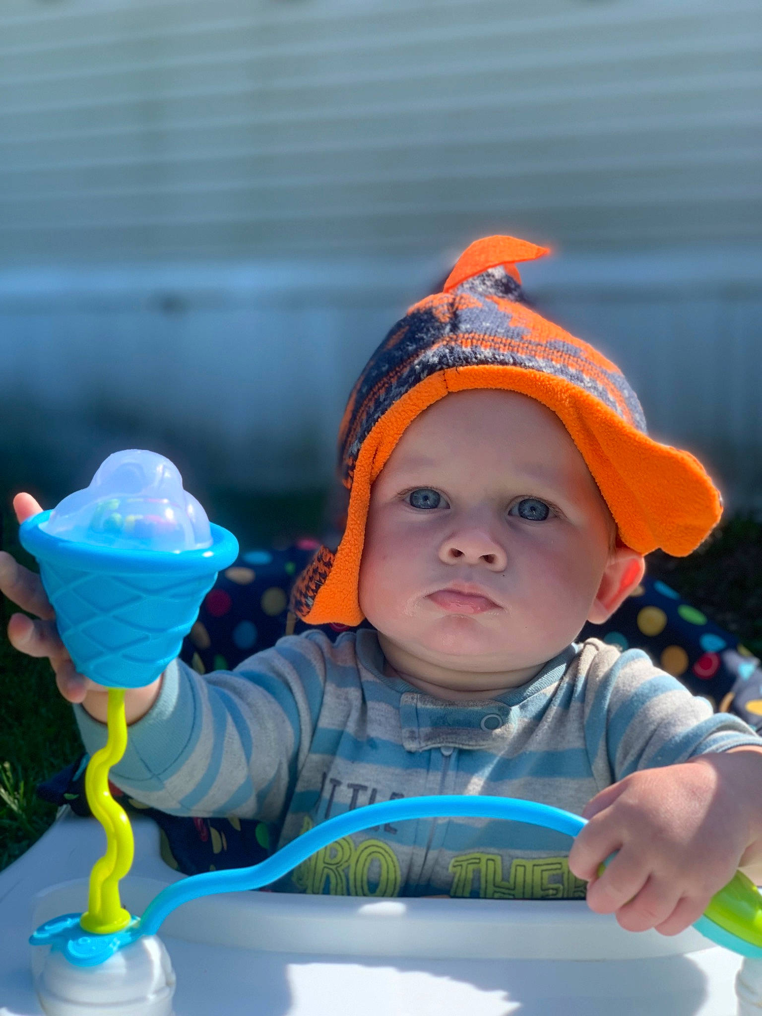 Gavin is registered to the contest to win money with this photo: baby, baby_toddler_clothing, cap, child, dessert, electric_blue, fun, grass, happy, headwear, ice_cream, ice_cream_cone, leisure, person, personal_protective_equipment, play, recreation, sitting, sorbetes, toddler
