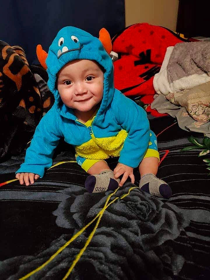 Jesus joined the competition — help win amazing prizes! baby, beanie, cap, child, costume, electric_blue, fashion_accessory, fictional_character, fun, happy, headwear, hoodie, leisure, people_in_nature, person, personal_protective_equipment, recreation, rope, sitting, smile