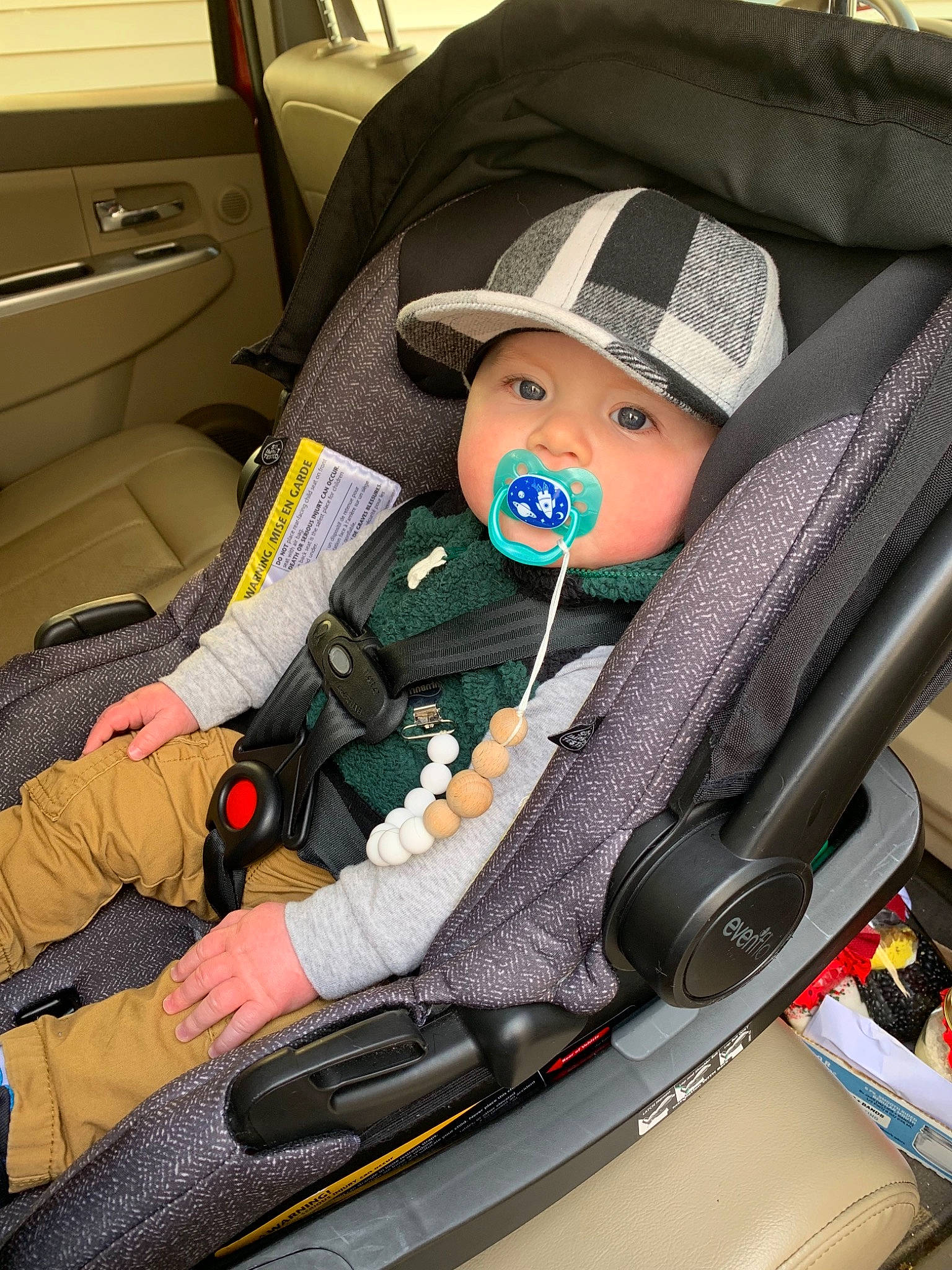 Raylan is registered to the contest to win money with this photo: auto_part, baby_in_car_seat, car, car_seat, car_seat_cover, child, city_car, family_car, headwear, motor_vehicle, person, seat_belt, vehicle, vehicle_door