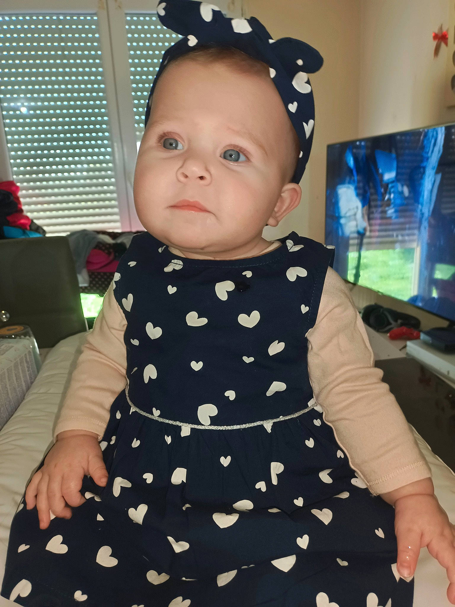 Romane participe au concours pour gagner de l'argent avec cette photo : baby, baby_toddler_clothing, cheek, child, day_dress, hairstyle, head, human_body, joint, one_piece_garment, organ, pattern, person, pink, product, sitting, skin, sleeve, standing, toddler