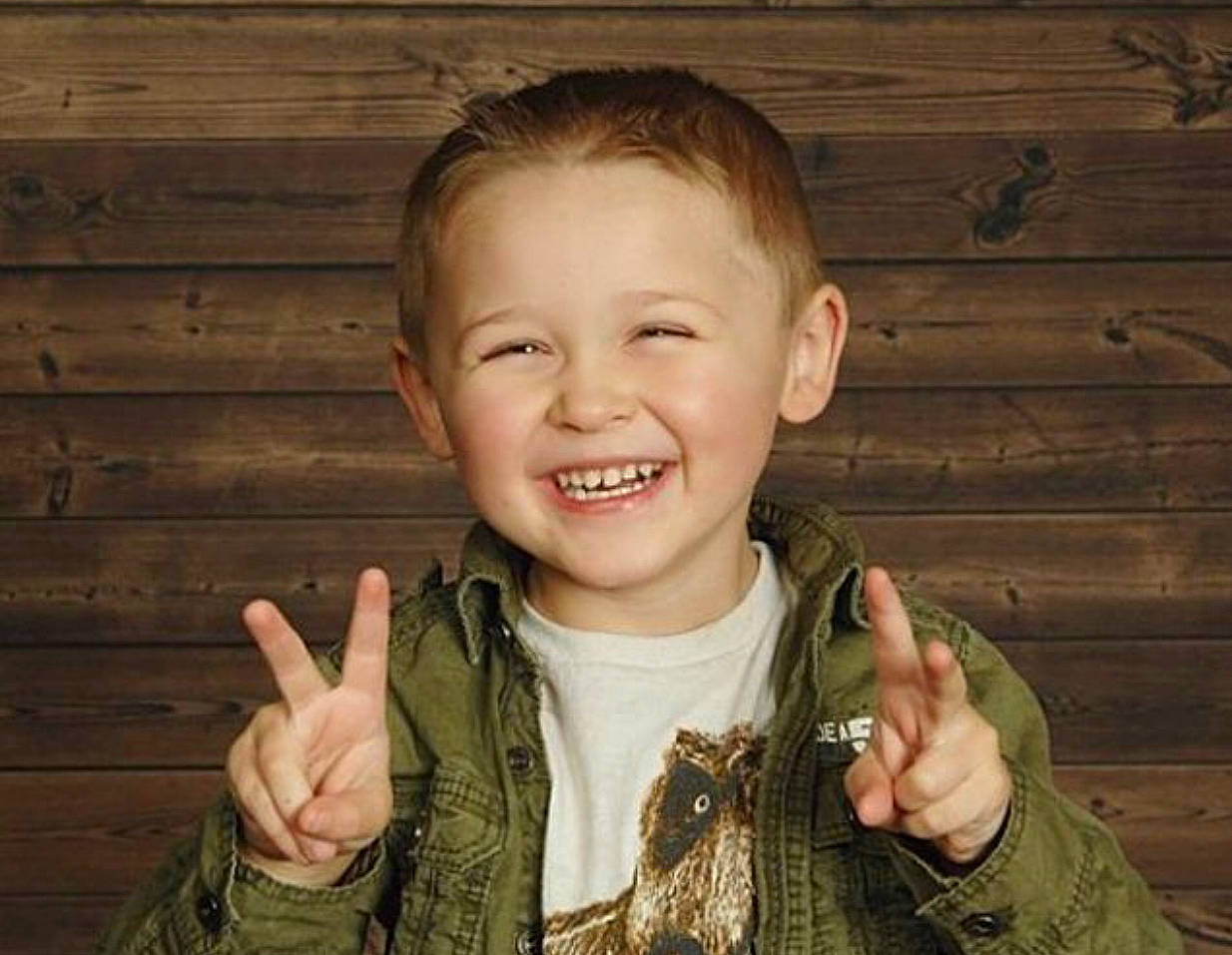 Isaiah is registered to the contest to win money with this photo: child, child_model, ear, facial_expression, finger, gesture, hand, happy, joy, laugh, person, portrait_photography, smile, thumb, toddler, tooth, wood