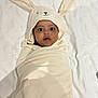 baby, bed, blanket, bunny_ears, child, cozy, cute, expression, face, head, indoors, infant, person, portrait, sleepwear, soft, surprised, towel, white, wrapped