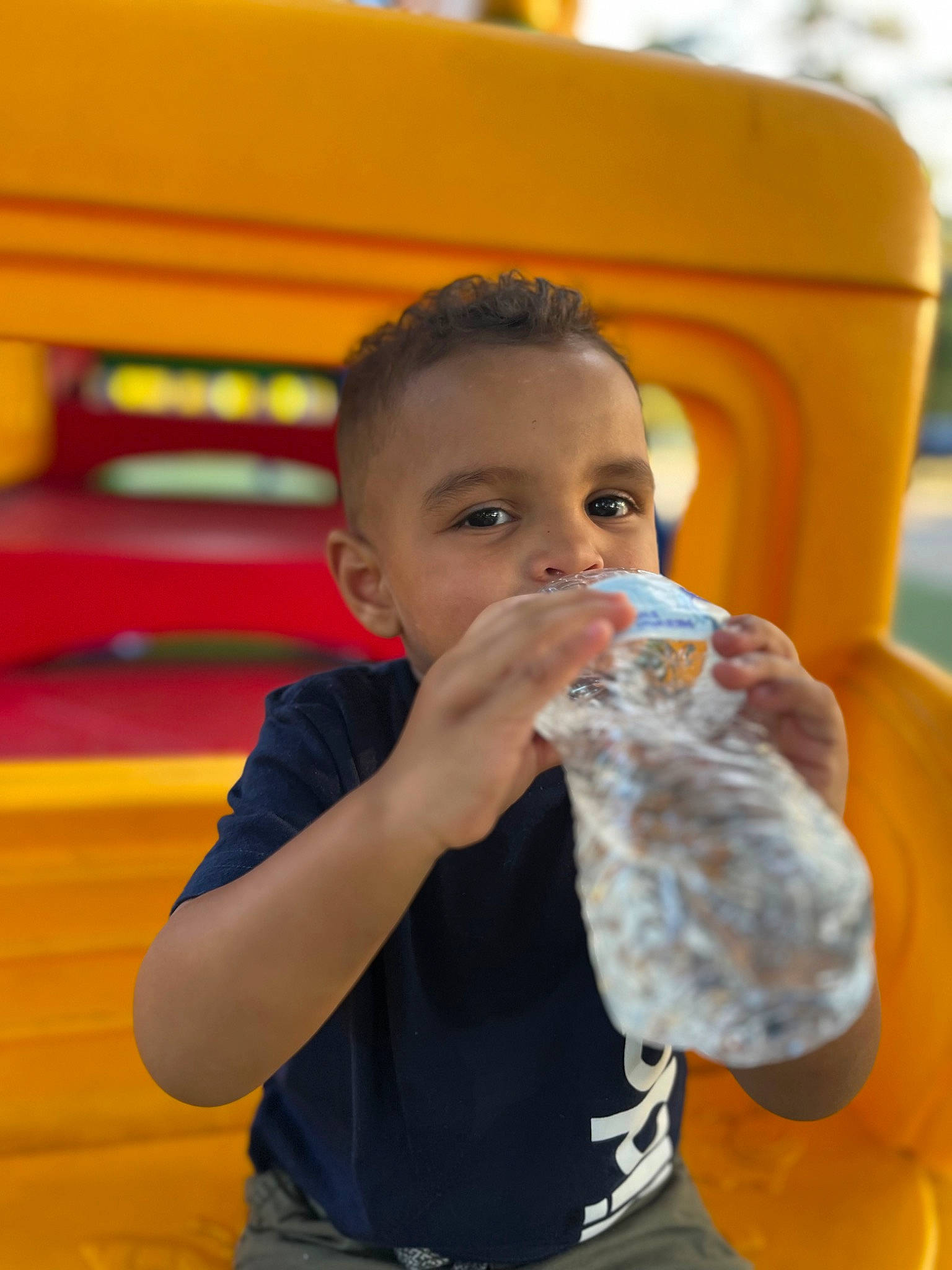 Miguel Wilson joined the competition — help win amazing prizes! baby_bottle, child, drink, drinking, drinking_water, drinkware, facial_expression, fun, gesture, hairstyle, happy, head, leisure, nose, person, plastic_bottle, recreation, summer, toddler, water