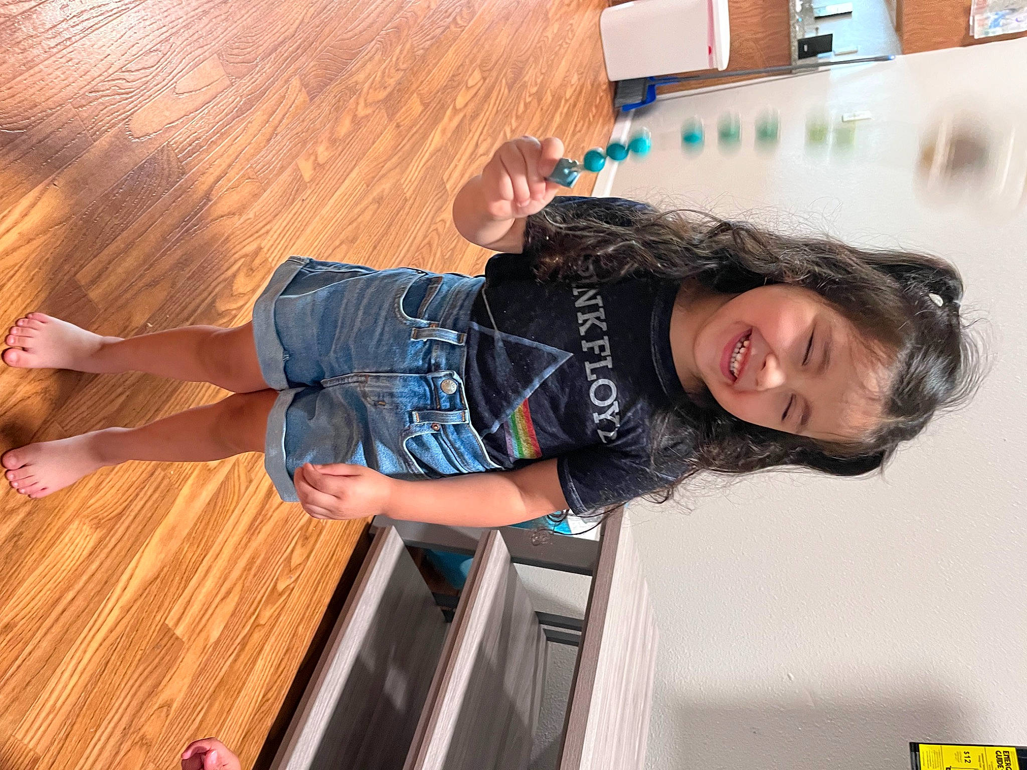 Gabriella joined the competition — help win amazing prizes! automotive_design, denim, elbow, electric_blue, flooring, fun, hardwood, human_leg, joy, knee, leisure, luxury_vehicle, person, sitting, smile, sportswear, t_shirt, thigh, varnish, waist