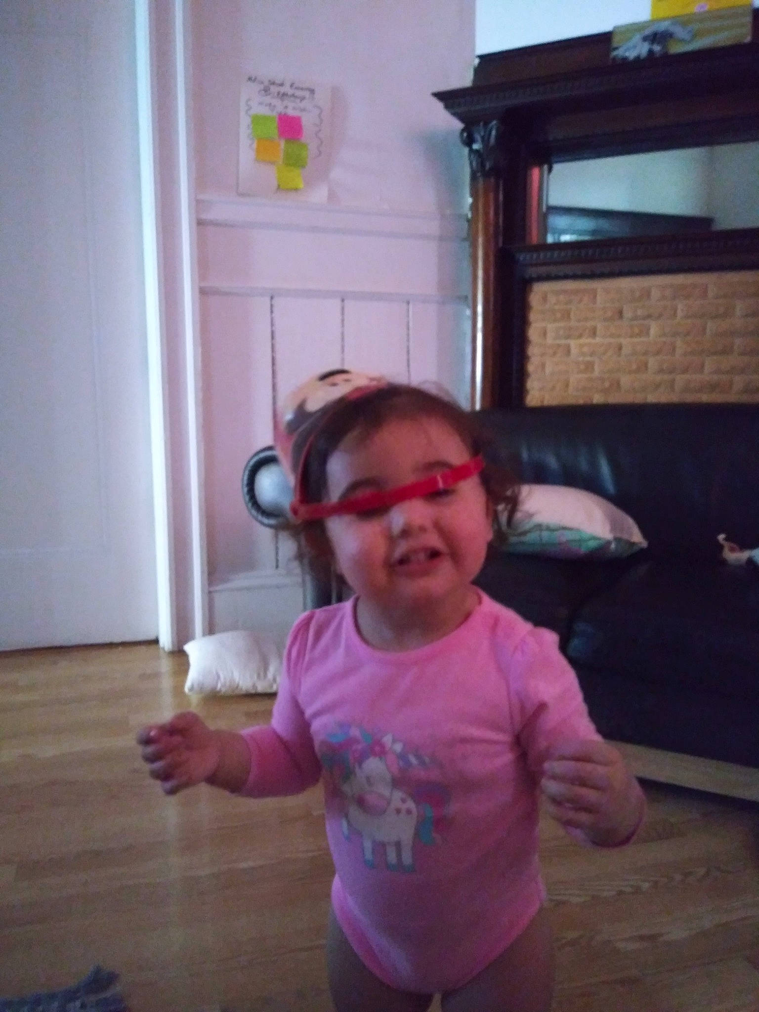 Malayah is registered to the contest to win money with this photo: baby_toddler_clothing, door, eyewear, floor, flooring, fun, glasses, goggles, happy, hardwood, magenta, person, personal_protective_equipment, pink, room, shoulder, sunglasses, t_shirt, toddler, vision_care