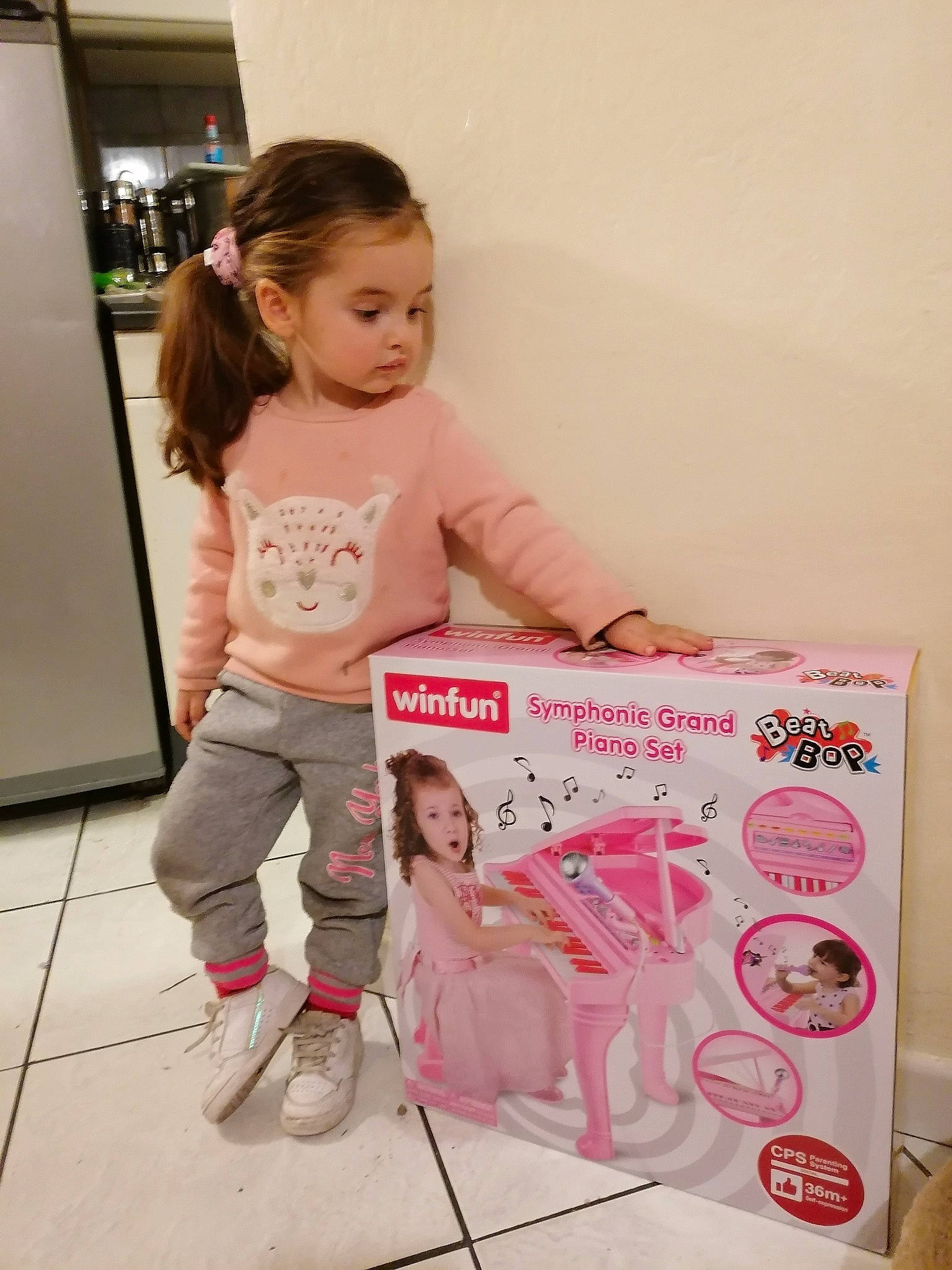 Rose Marie participe au concours pour gagner de l'argent avec cette photo : baby_products, cart, child, door, flooring, fun, happy, leg, magenta, pattern, person, pink, play, product, room, sandal, sitting, skin, sleeve, surprise