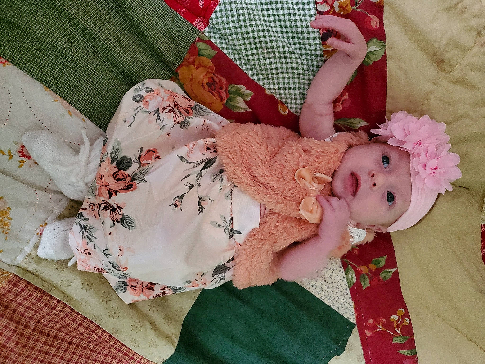 Cassie joined the competition — help win amazing prizes! baby, baby_products, baby_toddler_clothing, child, clothing, day_dress, dress, embellishment, face, hair_accessory, hand, head, headwear, linens, pattern, peach, person, pink, plant, room