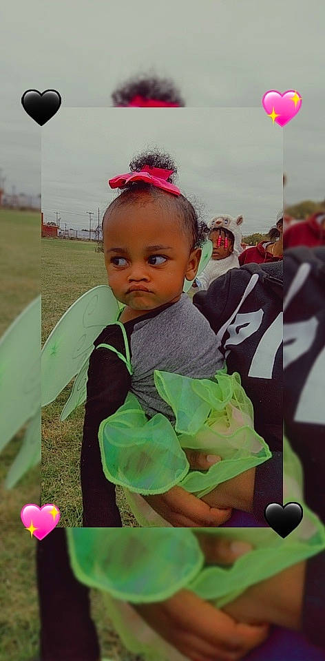 Serenity is registered to the contest to win money with this photo: baby, balloon, child, event, festival, fun, grass, happy, holiday, microphone, people, person, personal_protective_equipment, photography, public_event, recreation, saint_patricks_day, soil, t_shirt, toddler