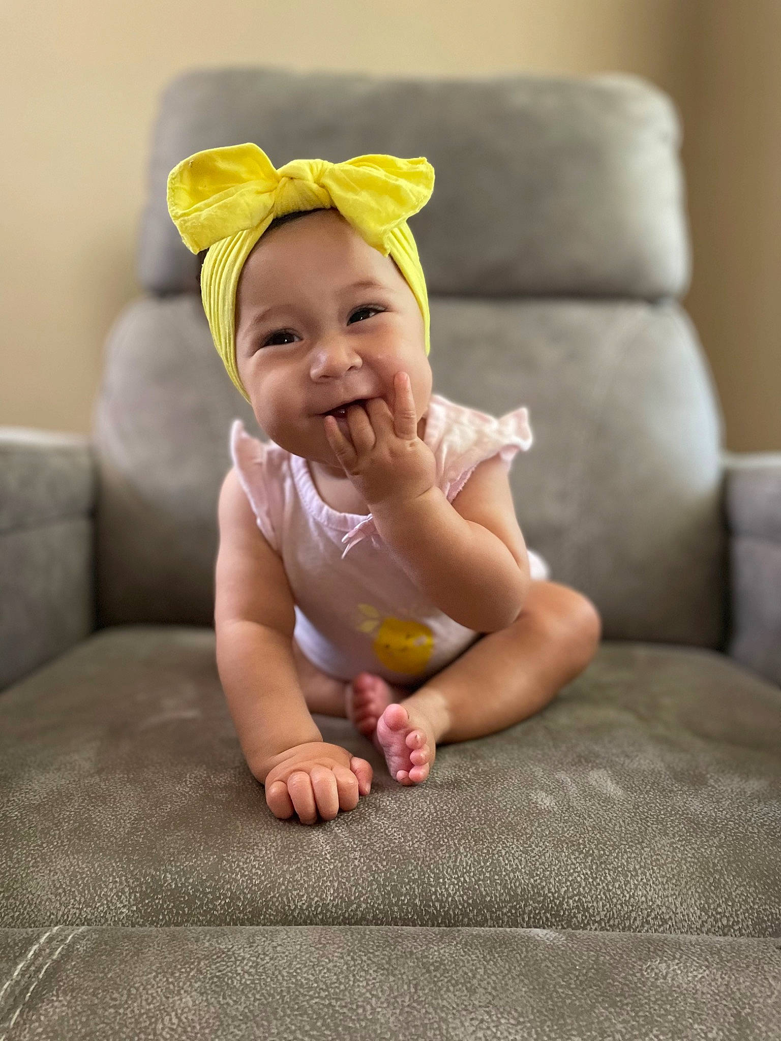 Ailani joined the competition — help win amazing prizes! baby, baby_laughing, baby_toddler_clothing, comfort, couch, face, finger, flash_photography, flooring, foot, fun, grass, happy, human_leg, person, sitting, skin, sleeve, smile, thumb