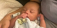 Mateo joined the competition — help win amazing prizes! baby, blanket, bear_pattern, sleeping, thumb_sucking, infant, person, arm, cozy, soft_texture, cute, resting, comfort, child, toddler, peaceful, holding, fabric, closeup, portrait