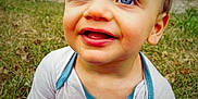 Jacob joined the competition — help win amazing prizes! baby, blue_eyes, casual_wear, child, clothing, cute, daylight, expression, face, grass, happy, nature, outdoor, person, portrait, shirt, sitting, smiling, toddler, young_child