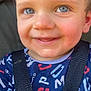 baby, blue_eyes, casual_wear, child, close_up, clothing, cute, daylight, face, happy, infant, outdoor, person, portrait, rosy_cheeks, seatbelt, smile, straps, toddler, young_child