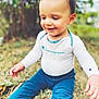 baby, blue_pants, casual, champion_brand, child, clothing, cute, daylight, grass, happy, nature, outdoor, person, playful, portrait, sitting, smiling, toddler, white_shirt, young_child