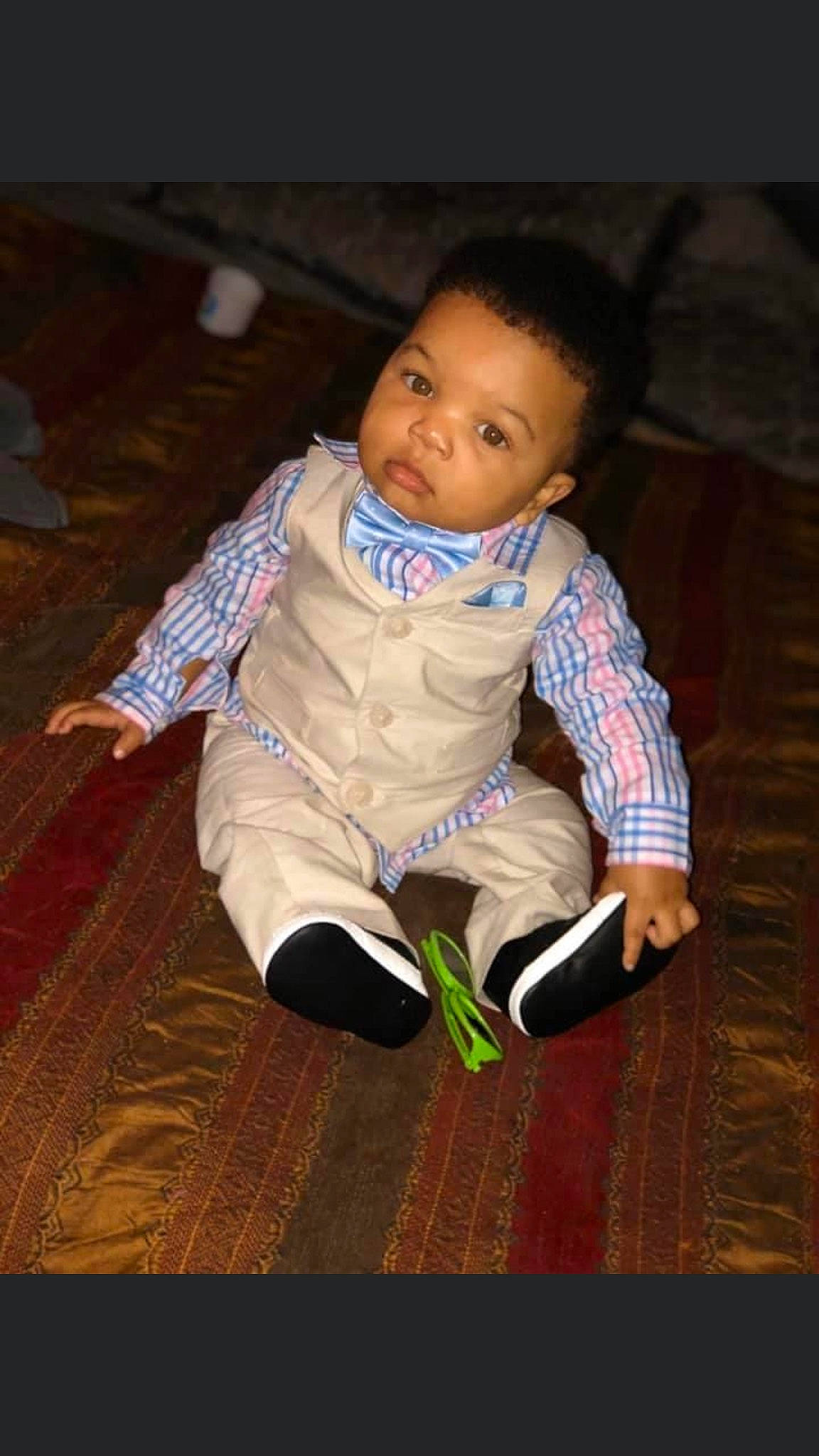 Cortez is registered to the contest to win money with this photo: baby, cheek, child, floor, flooring, person, sitting, skin, smile, toddler