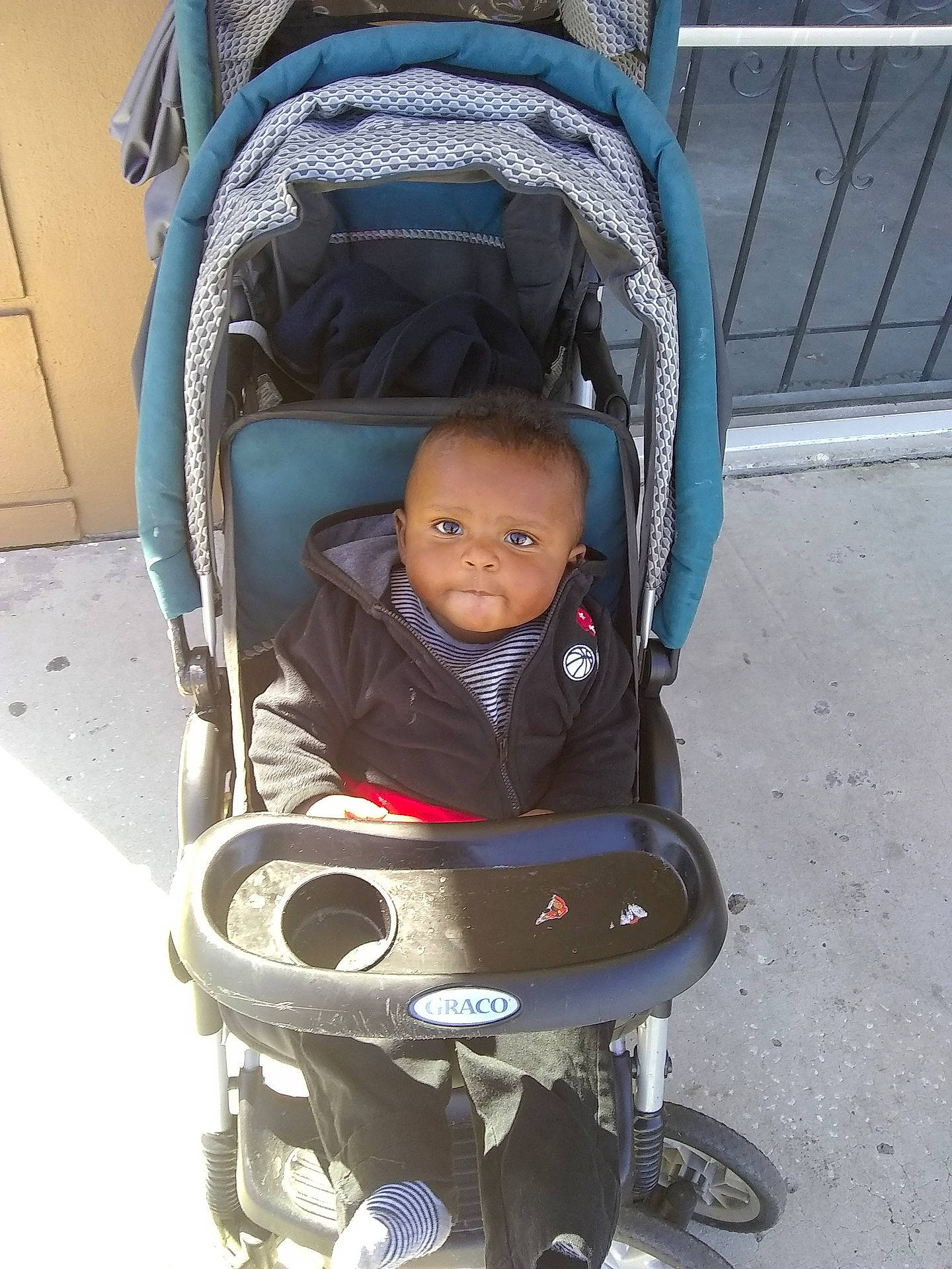 Darius is registered to the contest to win money with this photo: baby_carriage, baby_products, car_seat, child, person, product, toddler