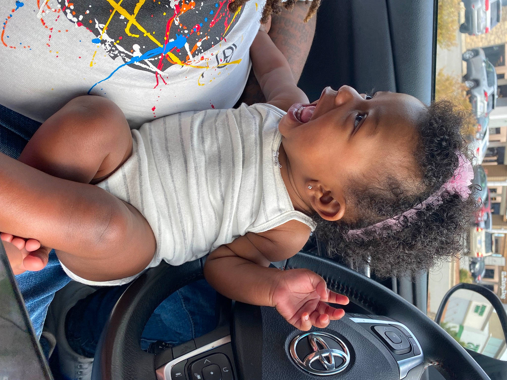 Xylo is registered to the contest to win money with this photo: auto_part, automotive_design, automotive_exterior, automotive_window_part, car, child, eyewear, family_car, fun, luxury_vehicle, motor_vehicle, mouth, people, person, personal_luxury_car, product, speedometer, steering_wheel, t_shirt, toddler