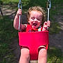 Johnathan joined the competition — help win amazing prizes! toddler, child, swing, playground, red_swing, curly_hair, happy, outdoor, sunlight, grass, baby, fun, smiling, summer, play, park, joyful, person, daylight, seat
