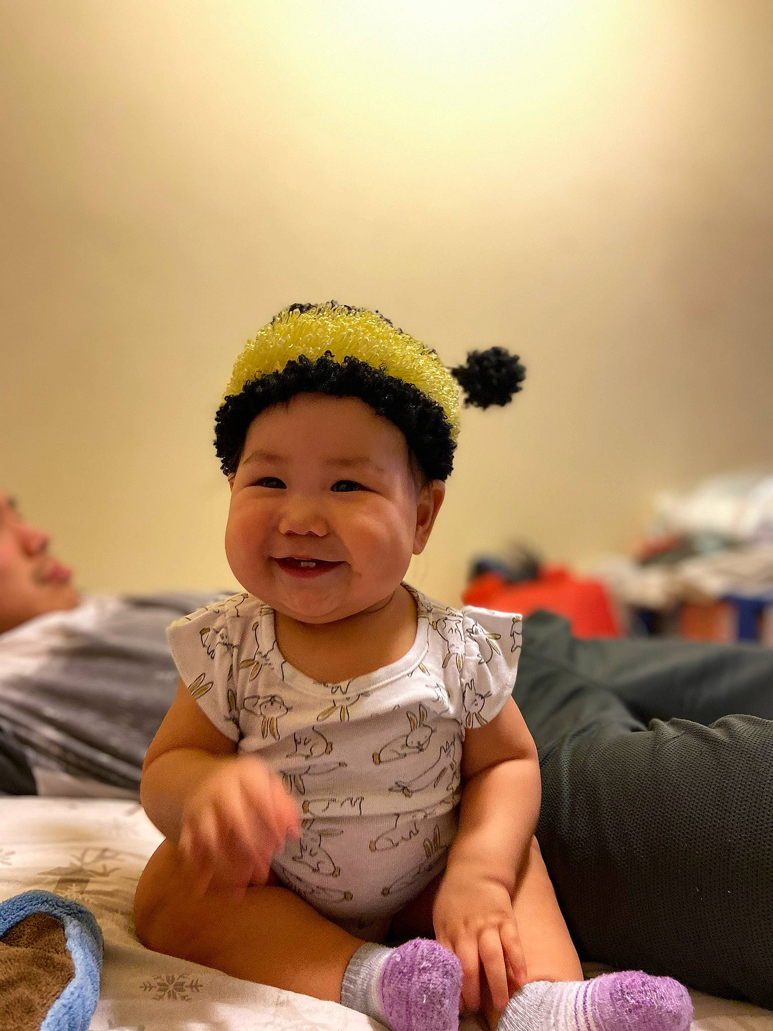 Susan is registered to the contest to win money with this photo: baby, child, hair_accessory, headband, headgear, person, play, smile, toddler