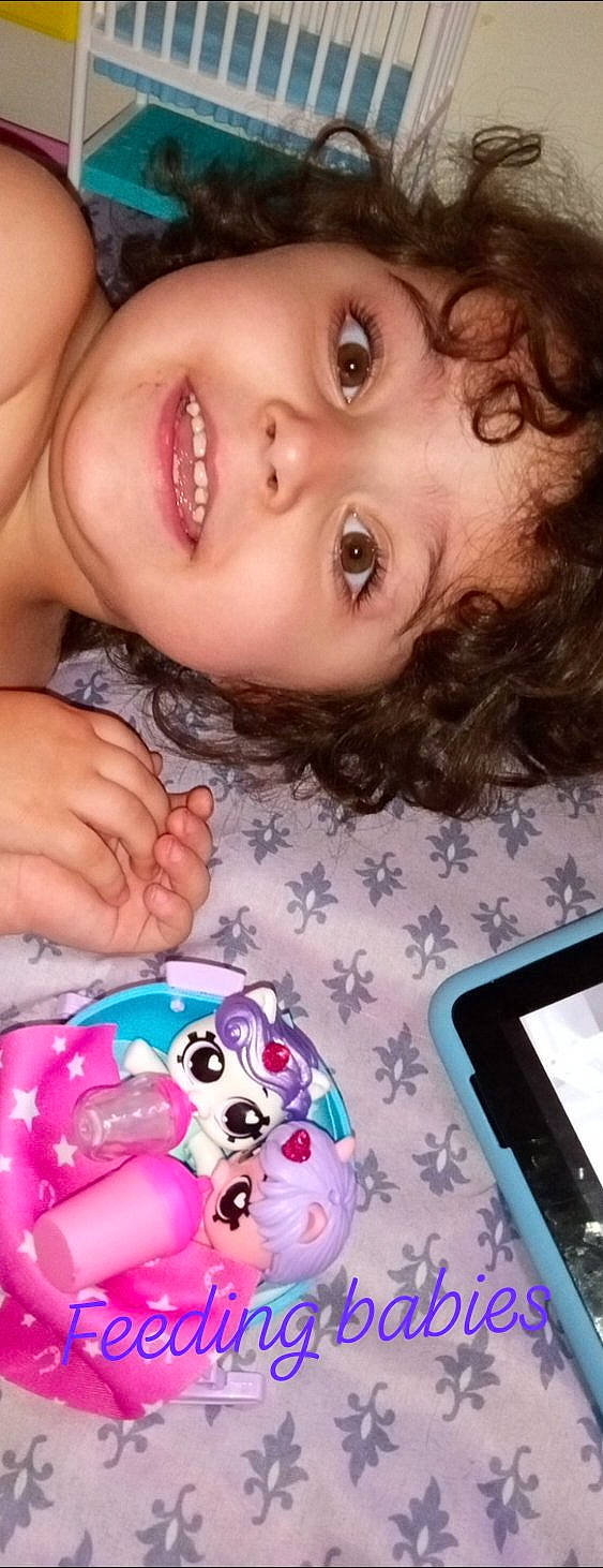 Addison is registered to the contest to win money with this photo: cheek, child, electronic_device, eyelash, facial_expression, finger, fun, happy, iris, joy, lip, mouth, nail, neck, nose, organ, people, person, skin, smile