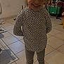 Gabryelle participe au concours pour gagner de l'argent avec cette photo : child, girl, smile, indoor, floor, tile, clothing, boots, leggings, patterned_top, happy, standing, window, furniture, household_items, light, portrait, young, casual_wear, person