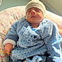 Livio participe au concours pour gagner de l'argent avec cette photo : newborn, baby, infant, sleeping, blue_clothing, knitted_hat, medical_tube, hospital, pillow, cozy, cute, resting, indoors, child, face, hand, socks, soft_light, portrait, star_pattern