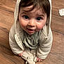Hisae participe au concours pour gagner de l'argent avec cette photo : child, baby, toddler, face, eyes, hoodie, hood, cute, hardwood_floor, indoor, sitting, looking_up, smile, rosy_cheeks, onesie, stuffed_toy, hands, hair, clothing, portrait