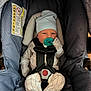 Jaxson is registered to the contest to win money with this photo: baby, infant, pacifier, car_seat, hat, mittens, straps, clothing, pattern, fabric, seat, safety, child, newborn, cute, indoor, portrait, person, baby_clothes, comfort