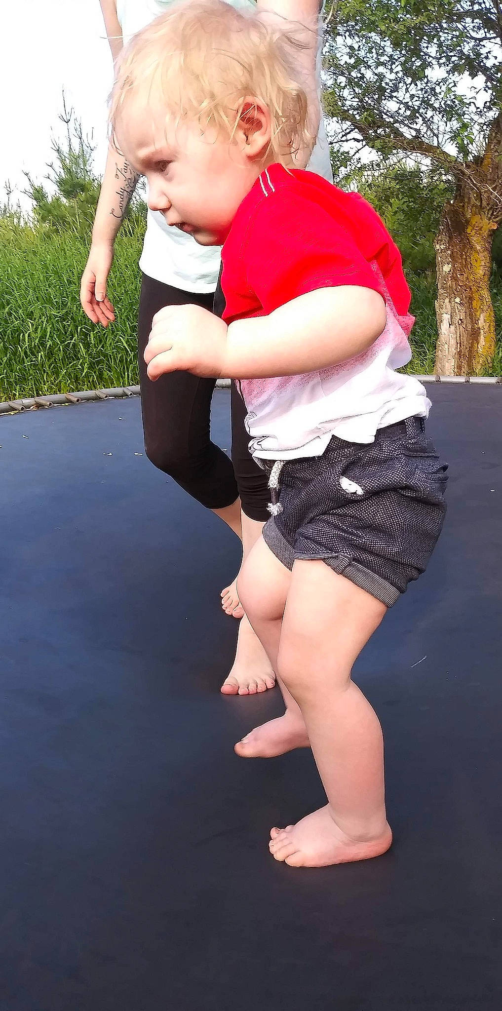 Kodie is registered to the contest to win money with this photo: arm, child, fun, human_leg, jeans, joint, knee, leg, person, shorts, thigh, toddler, trampoline, trampolining_equipment_and_supplies