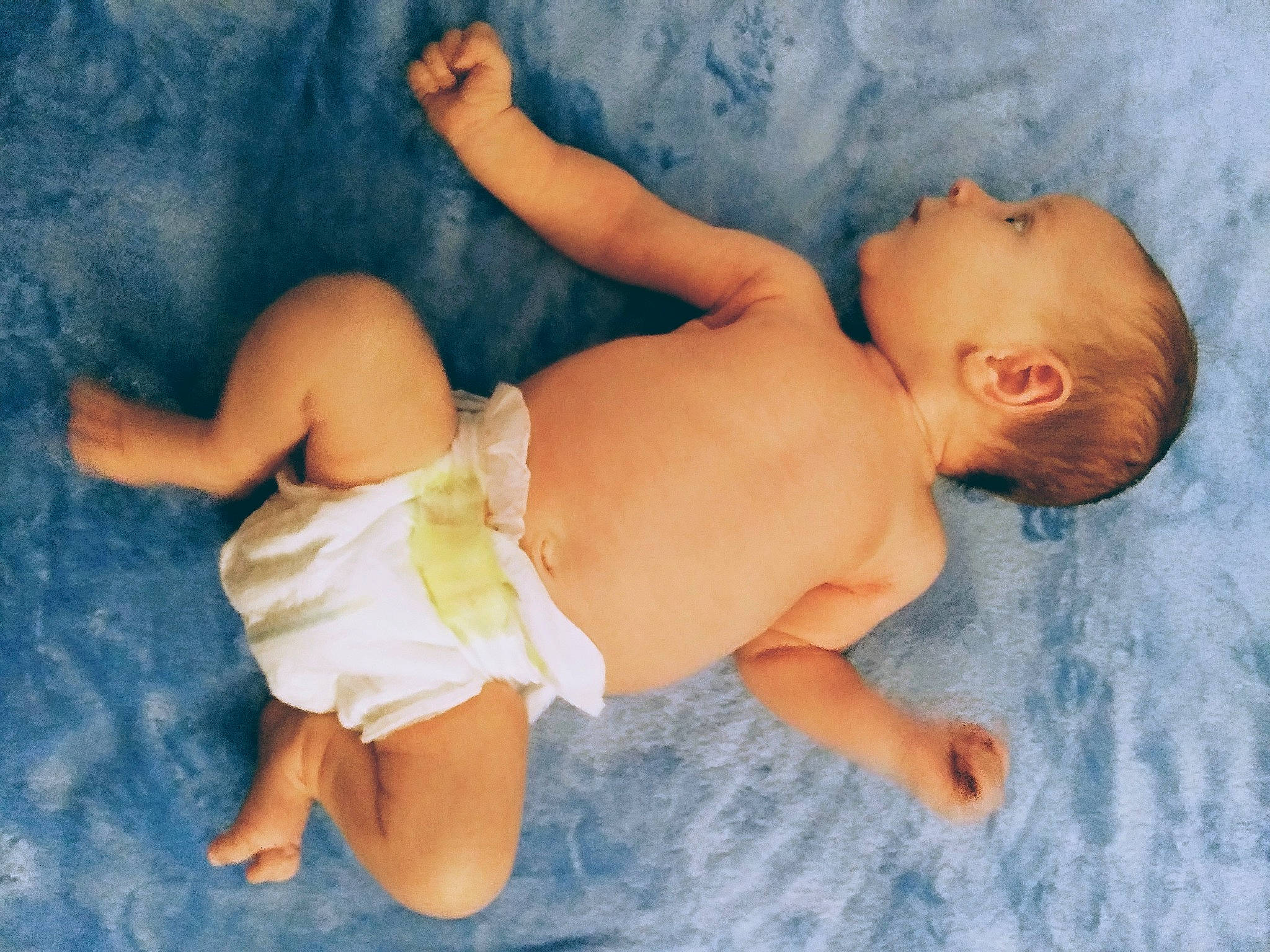 Karson is registered to the contest to win money with this photo: arm, baby, barefoot, blue, child, diaper, fun, hand, leg, muscle, person, photography, skin, smile, stomach, toddler