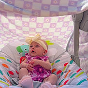 Rosalee joined the competition — help win amazing prizes! baby, baby_seat, blanket, blue_sky, bow, child, clouds, colorful, comfort, cute, grass, headband, infant, nature, outdoor, patterned_blanket, playful, sitting, sunlight, young