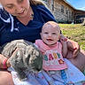 Rosalee joined the competition — help win amazing prizes! baby, woman, rabbit, outdoor, grass, house, blue_sky, smile, bib, blanket, tattoo, pacifier, sunny, happy, person, animal, pet, holding, nature, casual_clothing
