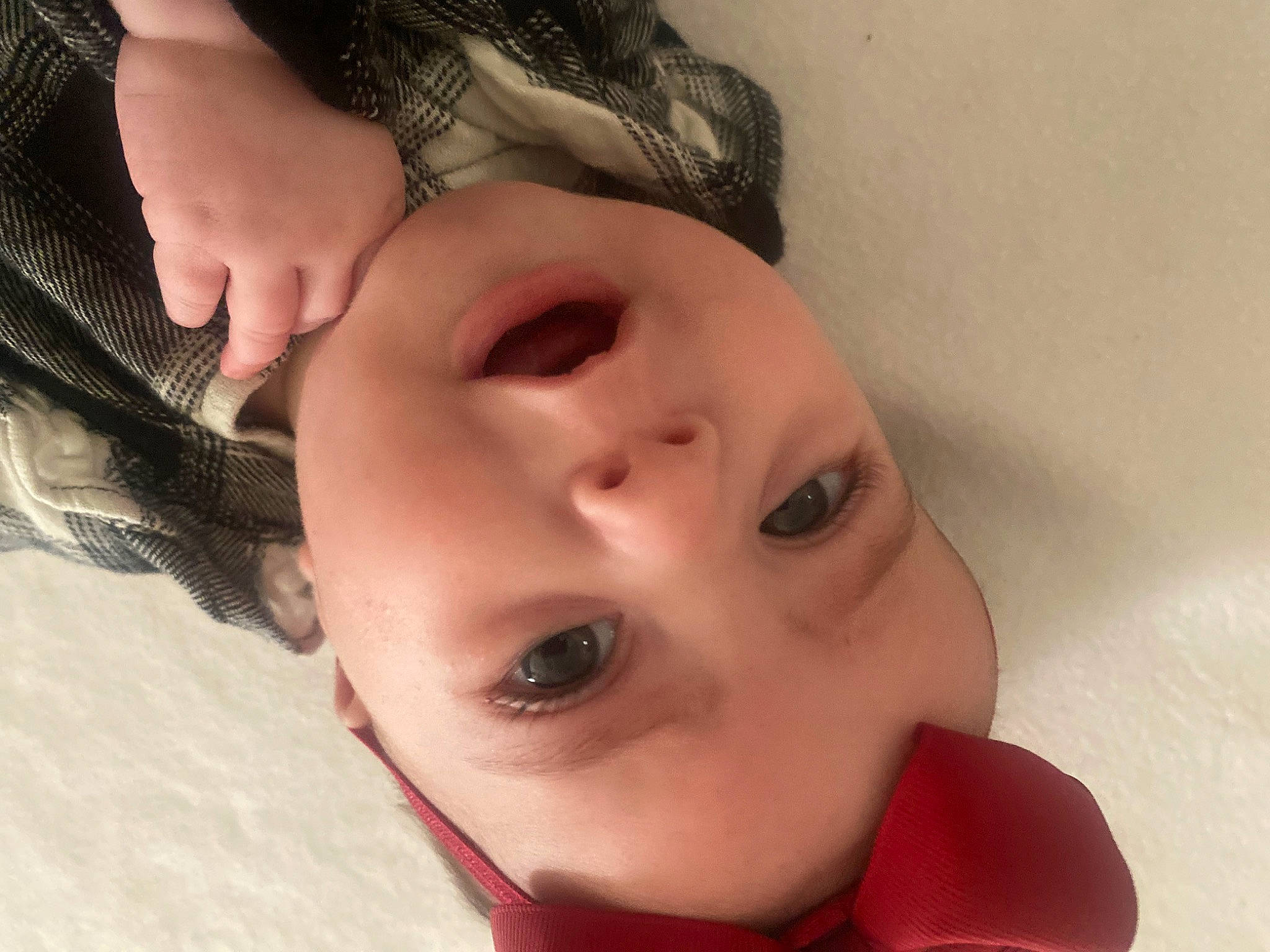Paisley is registered to the contest to win money with this photo: baby, black_hair, cheek, ear, eye, eyebrow, eyelash, forehead, gesture, happy, head, headgear, headwear, iris, jaw, lip, mouth, neck, nose, person
