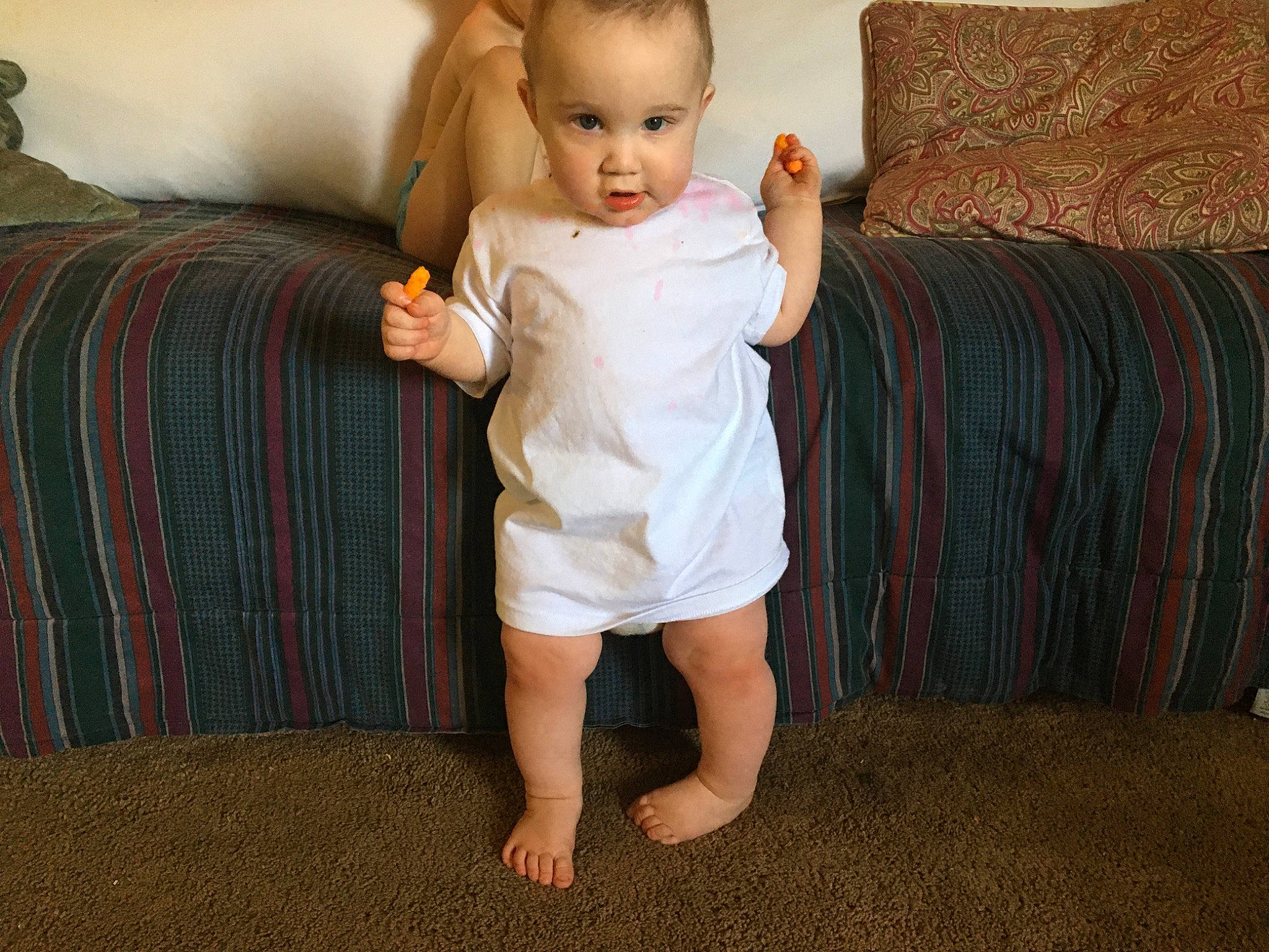 Iverson is registered to the contest to win money with this photo: arm, baby, barefoot, blond, child, dress, eye, finger, foot, head, human_leg, joint, leg, person, shoe, shoulder, sitting, skin, standing, thumb