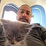 Beaver Cleaver joined the competition — help win amazing prizes! man, kitten, cat, indoor, selfie, blur, face, person, animal, pet, window, blue, shirt, fur, whiskers, eyes, head, portrait, light, expression