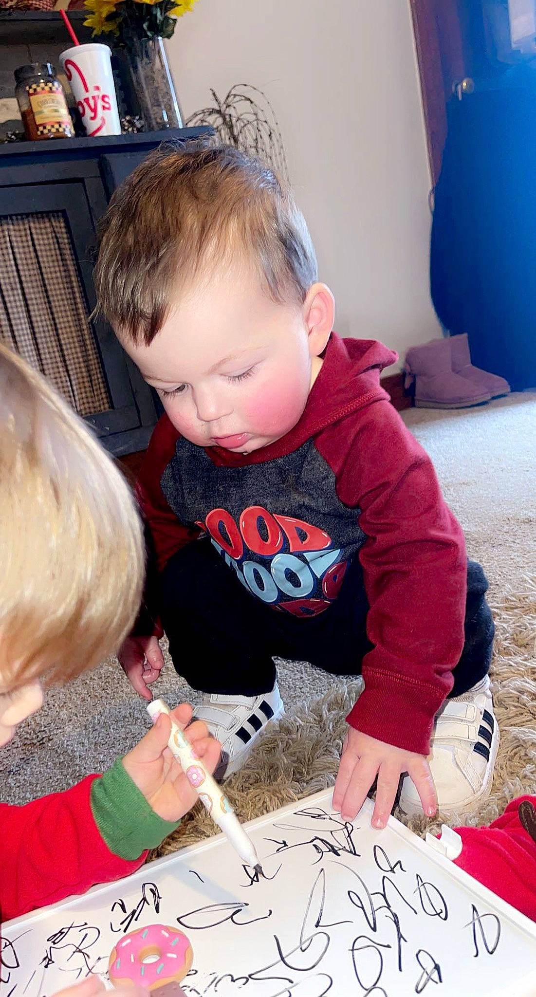 Ashtyn joined the competition — help win amazing prizes! art, baby, baby_toddler_clothing, blue, carmine, child, flooring, font, fun, handwriting, homework, pattern, person, play, reading, shelf, sitting, t_shirt, toddler, writing