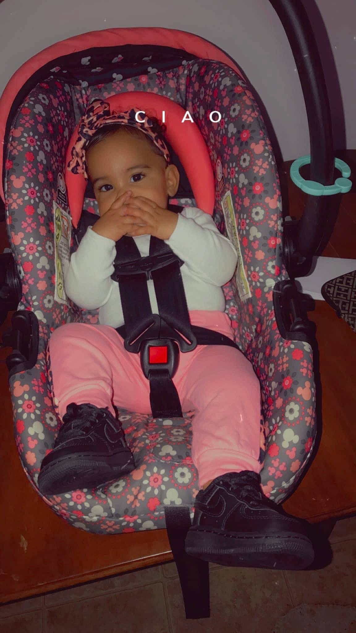 Kimorah is registered to the contest to win money with this photo: auto_part, baby, baby_carriage, baby_products, baby_safety, baby_toddler_clothing, boot, car_seat, carmine, chair, child, comfort, fun, human_leg, lap, magenta, person, pink, sitting, thigh