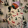 newborn, baby, pacifier, blanket, footprints, hat, sleeping, infant, forest, deer, squirrel, pine_trees, animal_print, cute, wrapped, peaceful, child, portrait, indoor, soft_lighting
