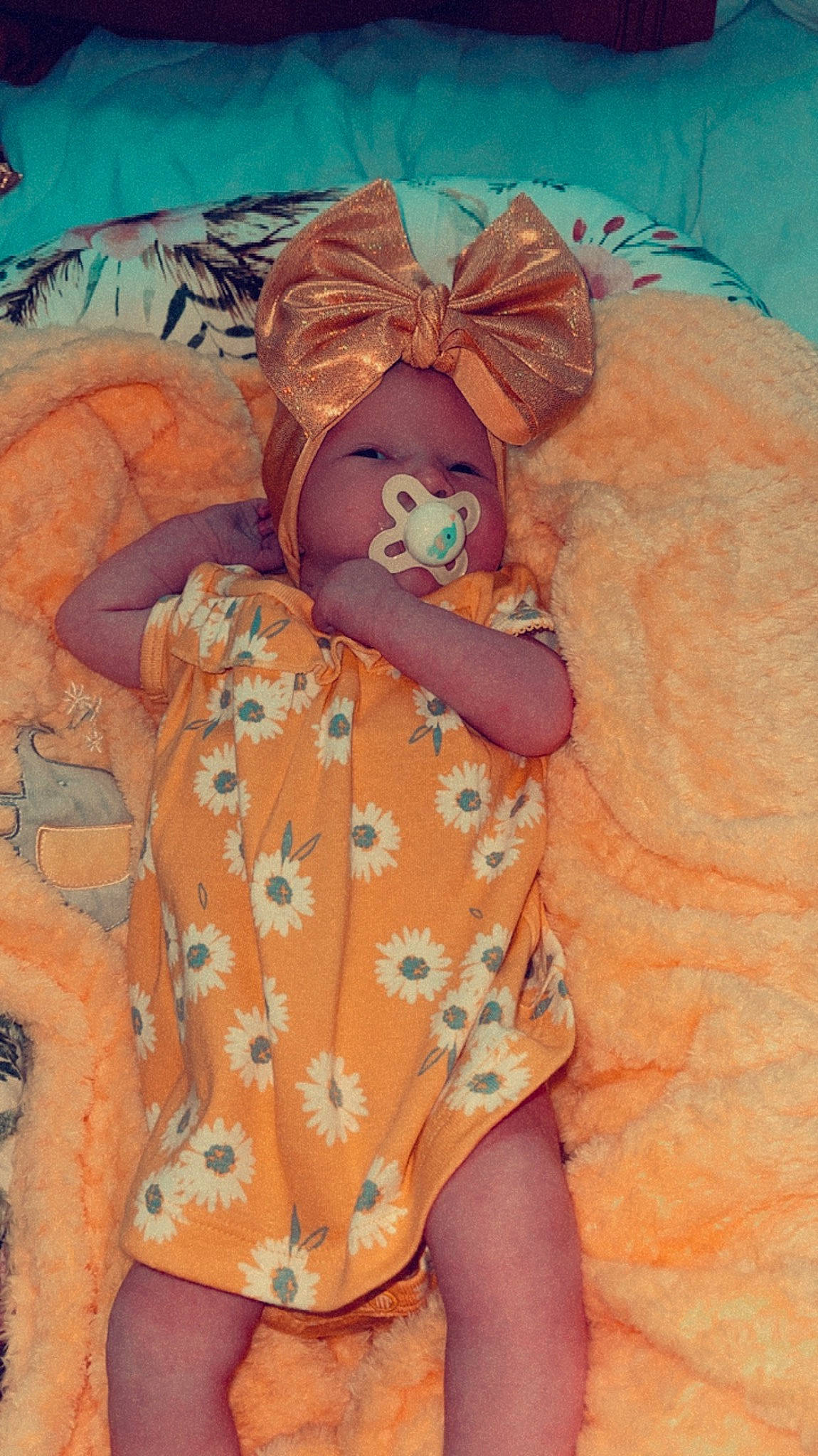 Izzabella is registered to the contest to win money with this photo: baby, baby_sleeping, baby_toddler_clothing, child, costume, doll, eye, fur, hat, human_leg, linens, orange, pattern, peach, person, room, sitting, stuffed_toy, thigh, toddler