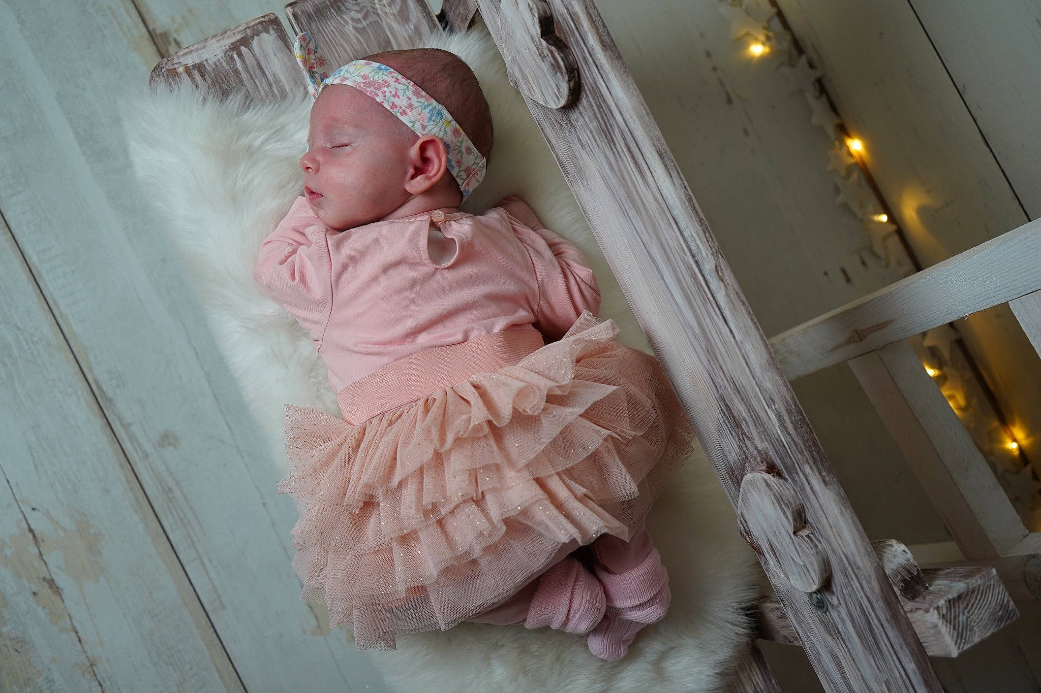 Joy participe au concours pour gagner de l'argent avec cette photo : baby, baby_products, baby_toddler_clothing, child, comfort, dress, event, flooring, fun, linens, magenta, pattern, peach, person, pink, portrait_photography, room, ruffle, sleeve, textile