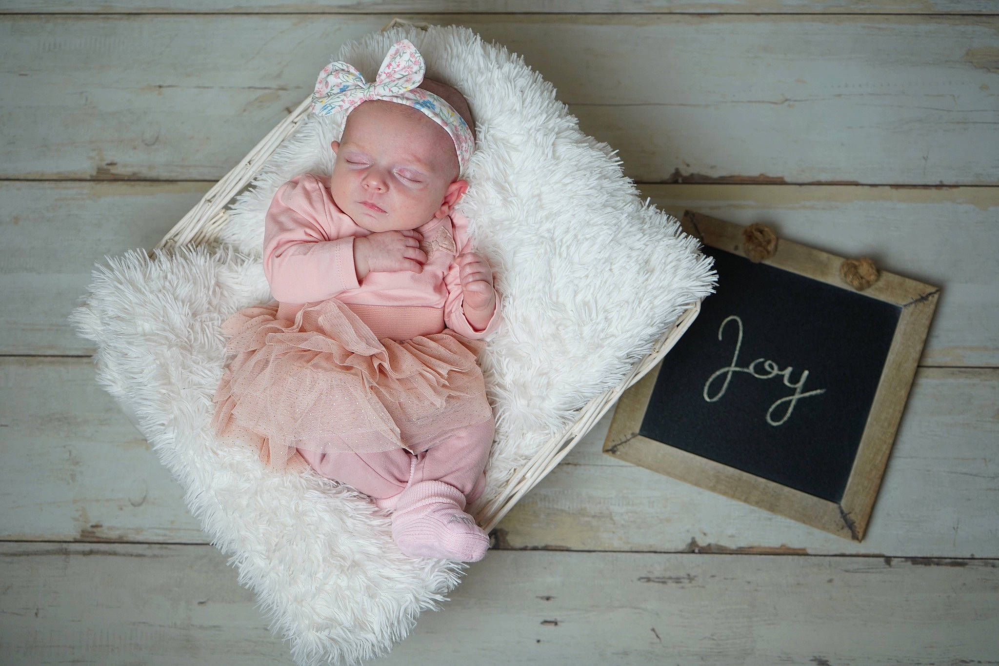 Joy participe au concours pour gagner de l'argent avec cette photo : baby, baby_toddler_clothing, child, comfort, fashion_accessory, flash_photography, flooring, font, fur, fur_clothing, happy, linens, magenta, peach, person, portrait_photography, rectangle, room, sitting, toddler