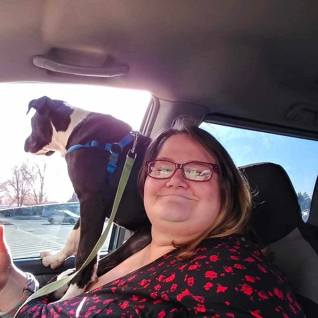 Pumba is registered to the contest to win money with this photo: air_travel, auto_part, automotive_design, automotive_exterior, automotive_window_part, black_hair, car_seat, cool, event, eyewear, family_car, fun, happy, long_hair, skin, smile, travel, vehicle_door, vision_care, windshield