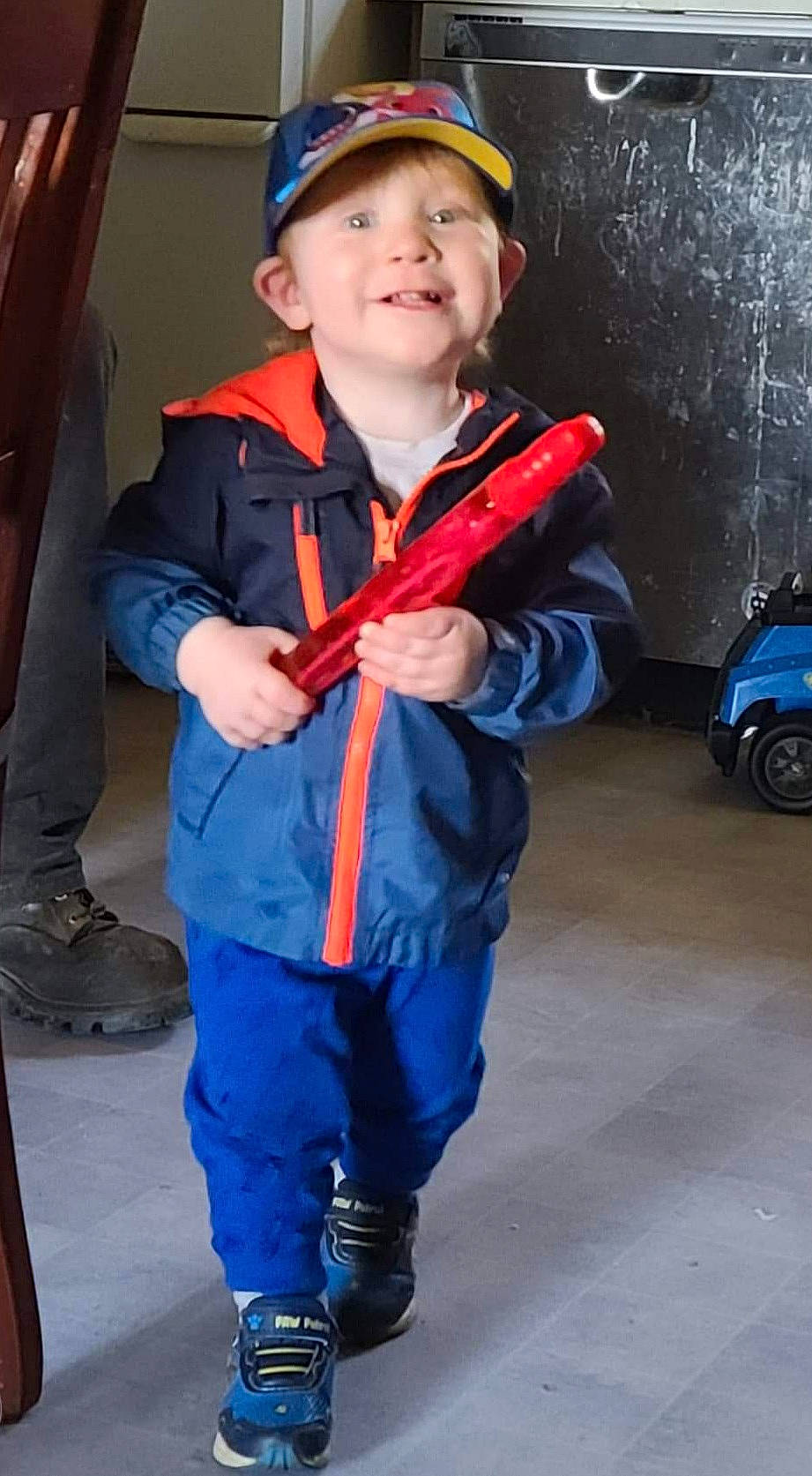 Ernest is registered to the contest to win money with this photo: blue, denim, electric_blue, footwear, fun, headgear, headwear, joy, people, person, photograph, recreation, shoe, sleeve, smile, snapshot, sneakers, standing, street_fashion, tire