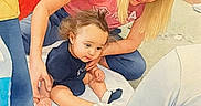 Selena is registered to the contest to win money with this photo: baby, woman, child, indoor, fan, blanket, floor, person, sitting, clothing, hair, skin, furniture, home, family, casual, interaction, happy, playful, people
