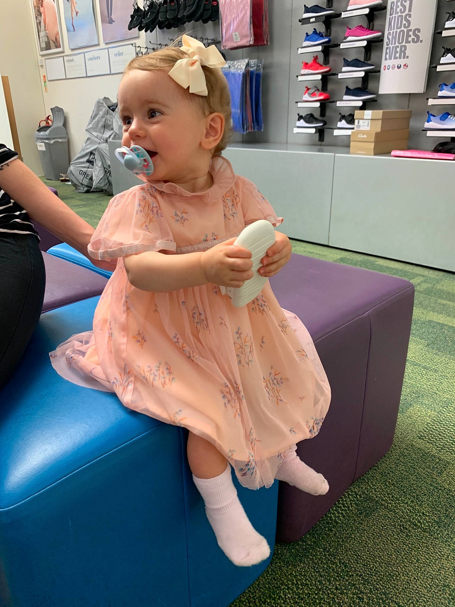 Effie is registered to the contest to win money with this photo: baby, child, dress, ear, furniture, hair, hairstyle, joint, leg, person, play, shoulder, sitting, toddler