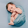 Charles participe au concours pour gagner de l'argent avec cette photo : baby, newborn, infant, wrapped, blue_cloth, hands, feet, face, eyes, skin, portrait, cute, soft_texture, studio, photography, isolated, background, lying_down, newborn_photography, peaceful