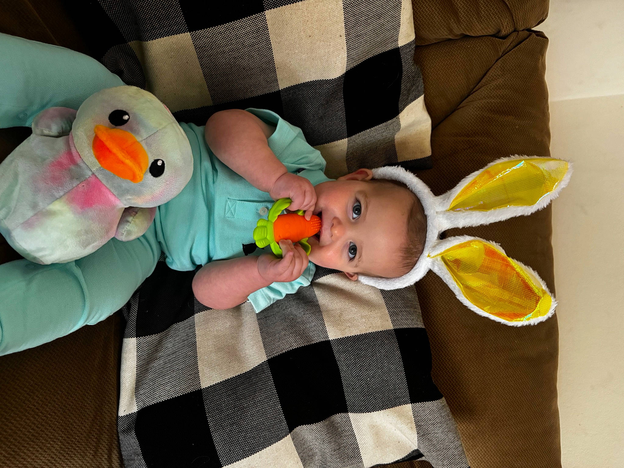 Remington is registered to the contest to win money with this photo: baby, baby_products, baby_safety, baby_sleeping, baby_toddler_clothing, baby_toys, child, comfort, hand, head, linens, pattern, person, plaid, product, room, stuffed_toy, tartan, textile, toddler